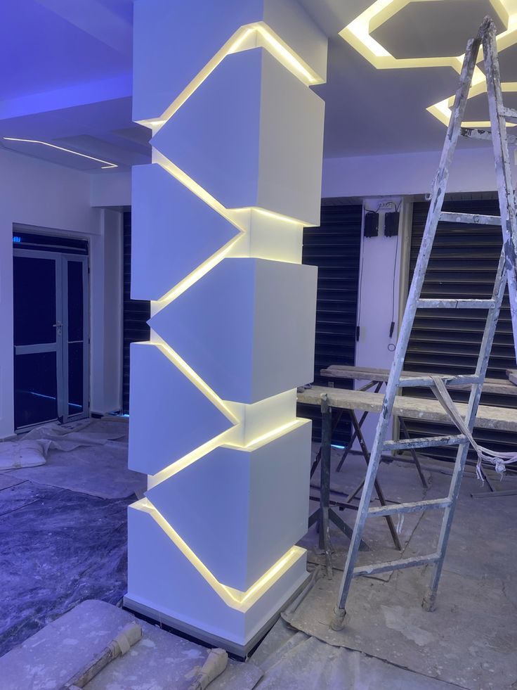 Interior pillar of stacked angled blocks with hidden LED lighting